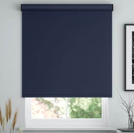 Roller shades half-drawn in a living room